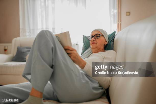 mother and daughter shopping online - cancer research institute stock pictures, royalty-free photos & images