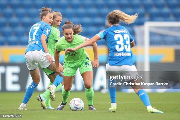 Lena Oberdorf of VfL Wolfsburg challenges Fabienne Dongus of TSG 1899 Hoffenheim during the Flyeralarm Frauen-Bundesliga match between TSG Hoffenheim...