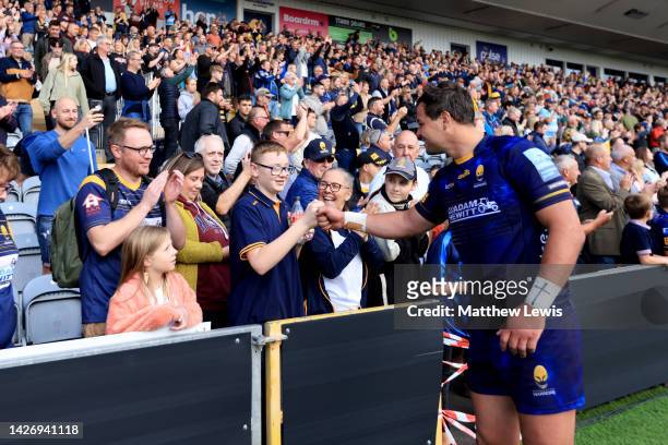 Francois Venter of Worcester Warriors fist bumps a fan following their sides victory in the Gallagher Premiership Rugby match between Worcester...