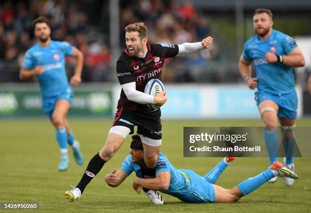 Elliot Daly of Saracens is tackled by Lloyd Evans of Gloucester Rugby during the Gallagher Premiership Rugby match between Saracens and Gloucester...