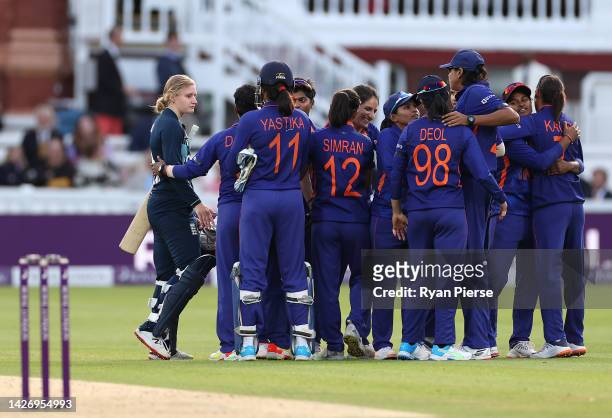 Charlie Dean of England is speaks to the Indian team after she was run out by Deepti Sharma of India to claim victory during the 3rd Royal London ODI...