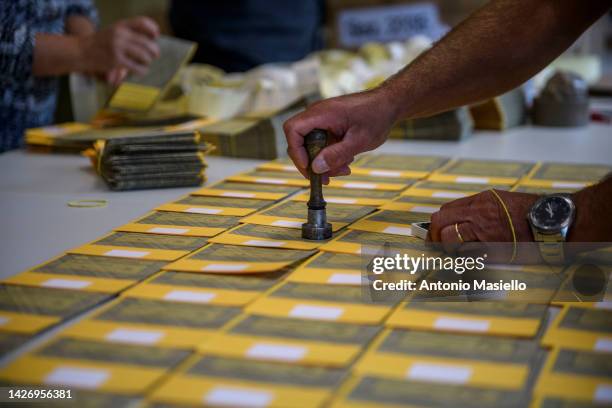 Man stamps ballots during the preparation of a polling station ahead of the September 25 general election, on September 24, 2022 in Rome, Italy. The...