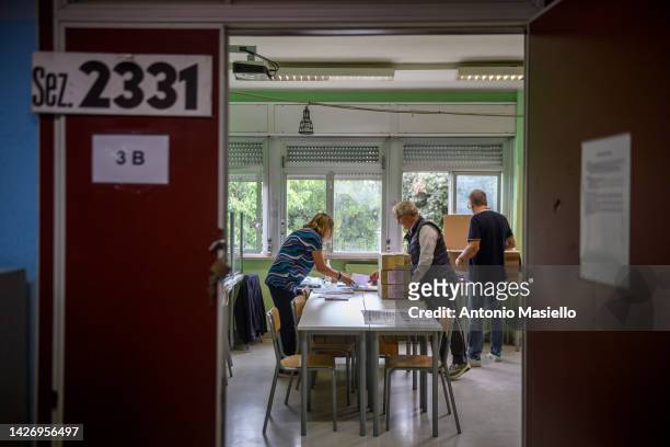 People prepare ballots and voting-related materials at a polling station ahead of the September 25 general election, on September 24, 2022 in Rome,...