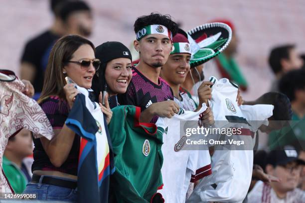 Fans of Mexico cheer on their team as they attend a training session ahead of a match between Mexico and Peru at Rose Bowl Stadium on September 22,...