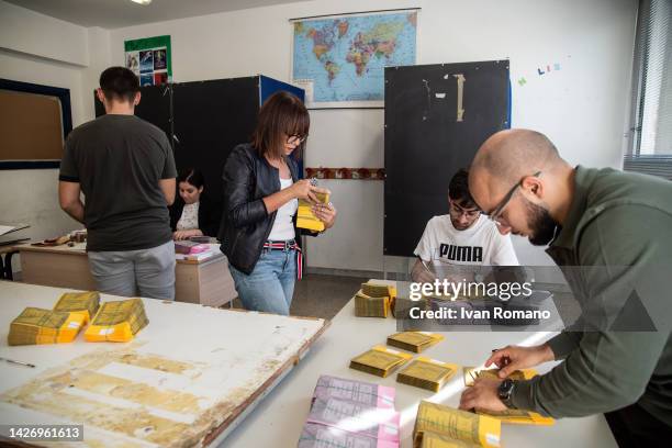 Polling station officials prepare ballots papers to vote for Italian general election scheduled for Sunday 25 September on September 24, 2022 in...