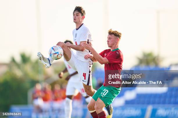Charlie Patino of England competes for the ball with Elias Kurt of Morocco during an international friendly game between England U20 and Morocco U20...