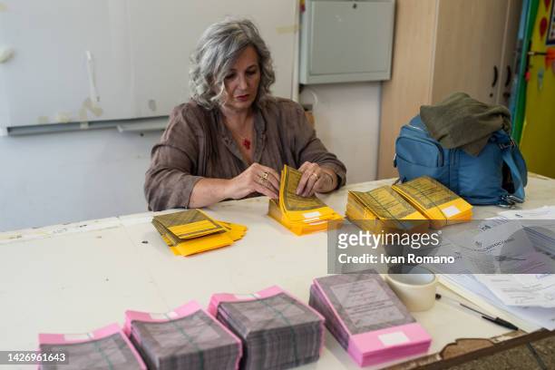 Polling station officials prepare ballots papers to vote for Italian general election scheduled for Sunday 25 September on September 24, 2022 in...