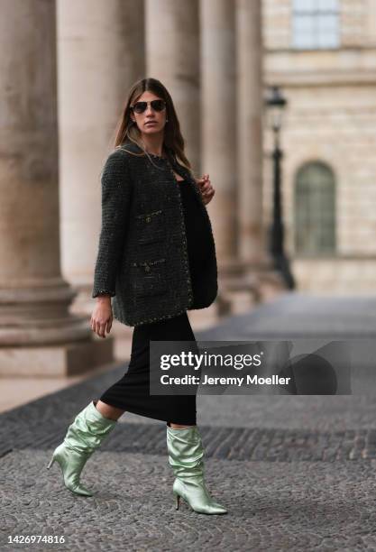 Veronika Heilbrunner is seen wearing a Celine sunglasses, black long dress from Skims, dark green tweed Chanel blazer jacket, black leather Celine...