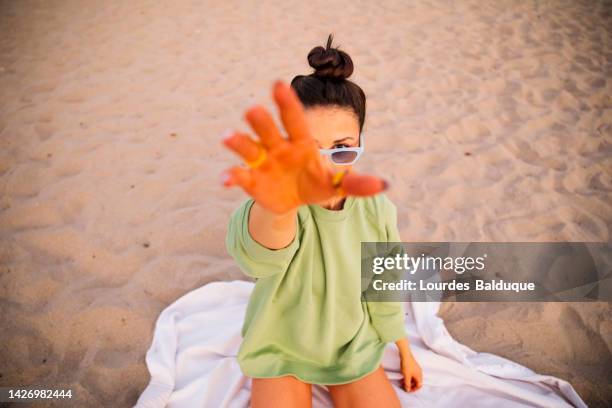 woman approaching hands on the beach - approaching bildbanksfoton och bilder