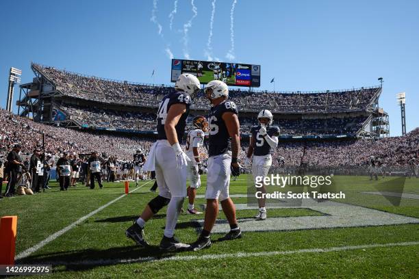 Tight end Brenton Strange of the Penn State Nittany Lions celebrates with tight end Tyler Warren after catching a pass for a touchdown against...