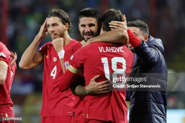 Aleksandar Mitrovic of Serbia celebrates with teammate Dusan Vlahovic after scoring their team's third goal and hat-trick during the UEFA Nations...