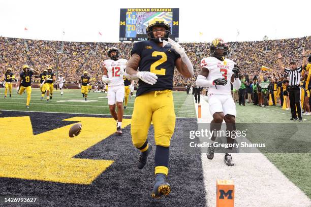 Blake Corum of the Michigan Wolverines scores a fourth quarter touchdown in front of Deonte Banks of the Maryland Terrapins at Michigan Stadium on...