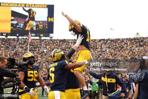 Roman Wilson of the Michigan Wolverines celebrates his fourth quarter touchdown with teammates while playing the Maryland Terrapins at Michigan...