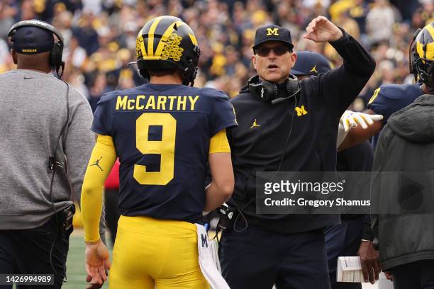 McCarthy of the Michigan Wolverines celebrates a second half touchdown with head coach Jim Harbaugh while playing the Maryland Terrapins at Michigan...