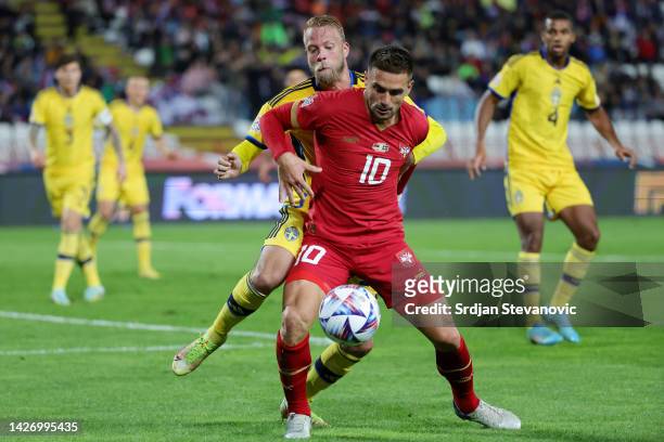 Dusan Tadic of Serbia is challenged by Daniel Sundgren of Sweden during the UEFA Nations League League B Group 4 match between Serbia and Sweden at...
