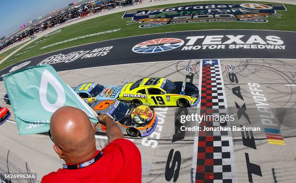 Brandon Jones, driver of the Menards/Pelonis Toyota, leads the field to the green flag to start the NASCAR Xfinity Series Andy's Frozen Custard 300...