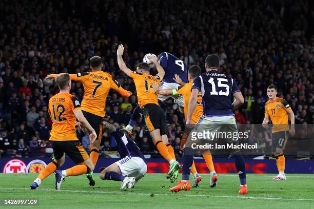 Alan Browne of Republic of Ireland contends for the aerial ball with Scott McTominay of Scotland, before a penalty is awarded for handball, during...