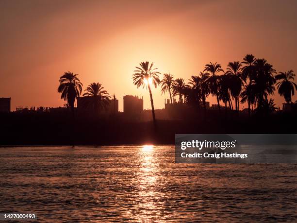 luxor egypt river nile sunset scene - nile river sunset stock pictures, royalty-free photos & images