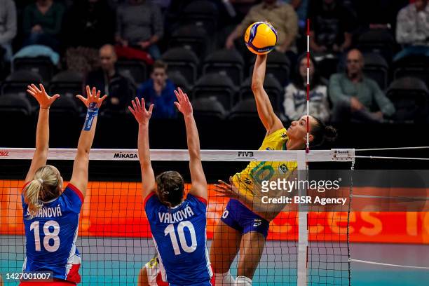 Gabriela Braga Guimaraes of Brazil spikes the ball while Pavlina Simanova of Czech Republic and Katerina Valkova of Czech Republic form a block...