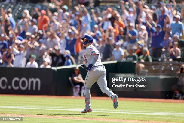 Pete Alonso of the New York Mets watches his two-run home run go over the wall in the first inning against the Oakland Athletics at RingCentral...