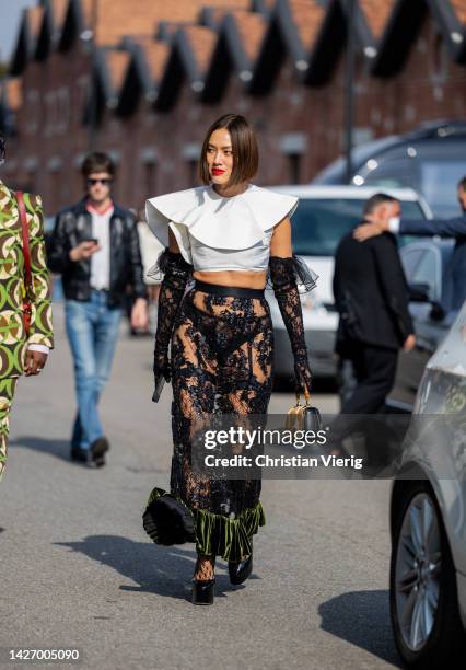 Tiffany Hsu wears see trough high waisted pants, white cropped top outside Gucci during the Milan Fashion Week - Womenswear Spring/Summer 2023 on...