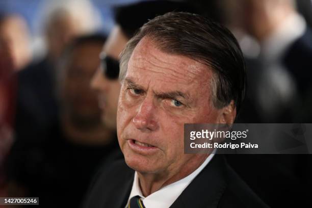 President of Brazil and current presidential candidate Jair Bolsonaro speaks to the media before a televised debate organized by a pool of local...