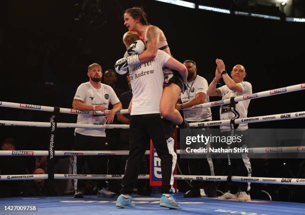 Terri Harper celebrates with a team member after defeating Hannah Rankin in the WBA and IBO World Super Welterweight title fight between Hannah...