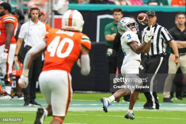 England-Chisolm of the Middle Tennessee Blue Raiders catches a touchdown during the first half against the Miami Hurricanes at Hard Rock Stadium on...