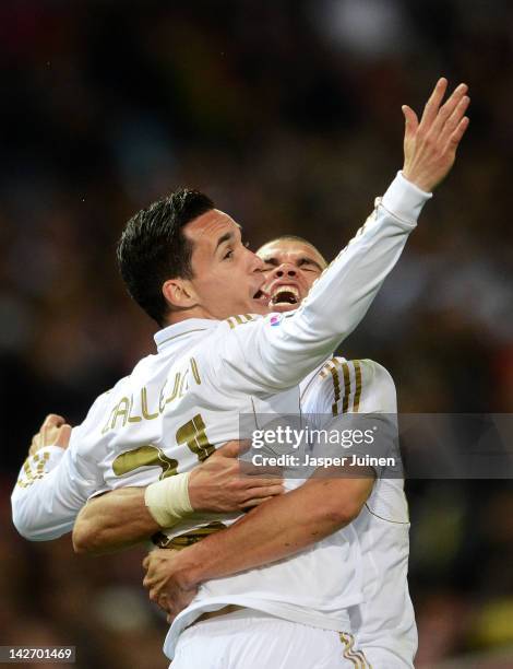 Jose Callejon of Real Madrid celebrates scoring with his teammates Pepe during the La Liga match between Club Atletico de Madrid and Real Madrid CF...