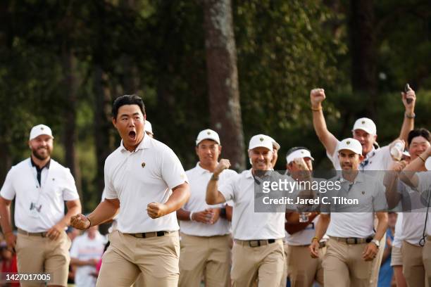 Tom Kim of South Korea and the International Team celebrates his hole-winning putt to win the match 1 Up with teammate Si Woo Kim of South Korea...