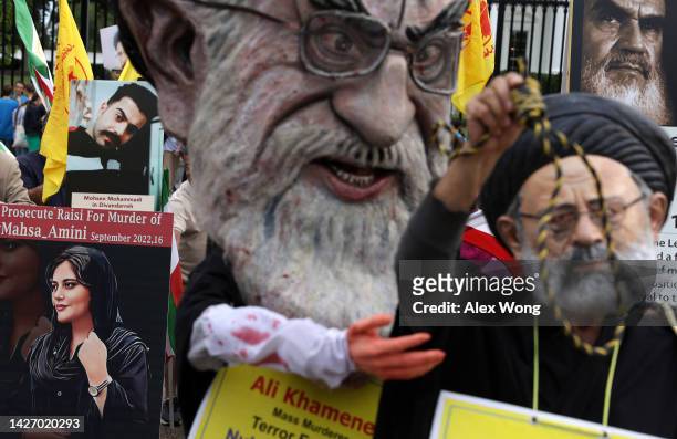 Demonstrators dress as Iranian Supreme Leader Ali Khamenei and Iranian President Ebrahim Raisi during a protest over the death of Mahsa Amini in Iran...