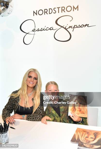 Jessica Simpson and Maxwell Drew Johnson celebrate the launch of her Fall Collection with fans and a special performance by the LA Roller Girls at...