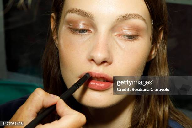 Model is seen during the make up in backstage at the Ermanno Scervino Fashion Show during the Milan Fashion Week Womenswear Spring/Summer 2023 on...