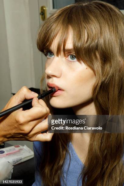 Model is seen during the make up in backstage at the Ermanno Scervino Fashion Show during the Milan Fashion Week Womenswear Spring/Summer 2023 on...