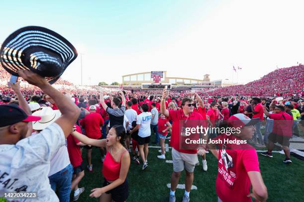 Fans rush the field as Texas Tech Red Raiders defeat the Texas Longhorns in overtime 37-34 with a field goal kicked by Trey Wolff at Jones AT&T...