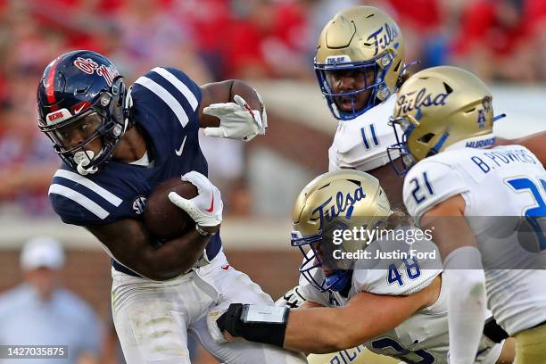 Quinshon Judkins of the Mississippi Rebels carries the ball during the second half against Owen Ostroski of the Tulsa Golden Hurricane at...