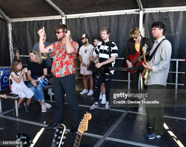 Ashton Irwin, Michael Clifford, Luke Hemmings and Calum Hood of 5 Seconds of Summer are seen backstage during the Daytime Stage at the 2022...