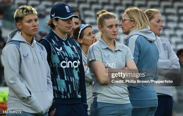 Issy Wong (L, Alice Davidson-Richards, Charlie Dean, Lisa Keightley and Sophie Ecclestone of England look on after India won the 3rd Royal London One...