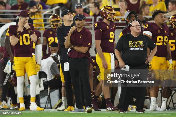 Head coach Herm Edwards of the Arizona State Sun Devils stands on the sidelines during the first half of the NCAAF game at Sun Devil Stadium on...