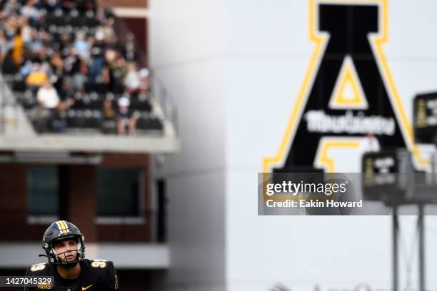 Michael Hughes of the Appalachian State Mountaineers prepares to kick an extra point against the James Madison Dukes in the second quarter at Kidd...