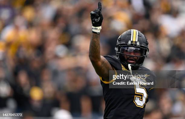 Dexter Lawson Jr. #5 of the Appalachian State Mountaineers celebrates a stop on a James Madison Dukes player on a 4th down at Kidd Brewer Stadium on...