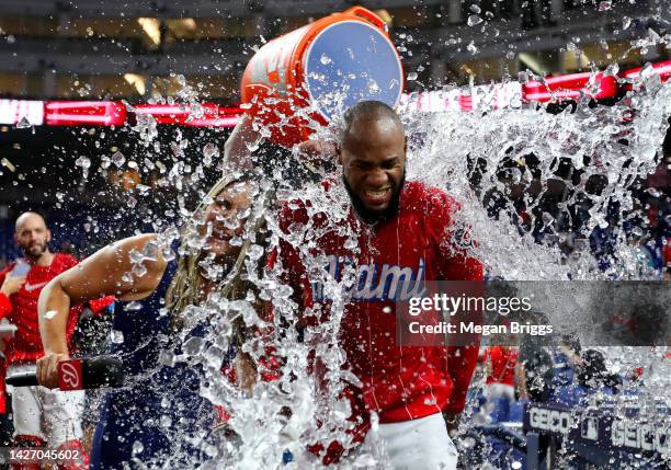 Bryan De La Cruz of the Miami Marlins gets a Gatorade bath by teammates after a game against the Washington Nationals at loanDepot park on September...