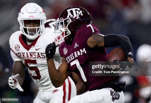 Defensive back Tyreek Chappell of the Texas A&M Aggies returns a fumble for a touchdown against running back Raheim Sanders of the Arkansas...