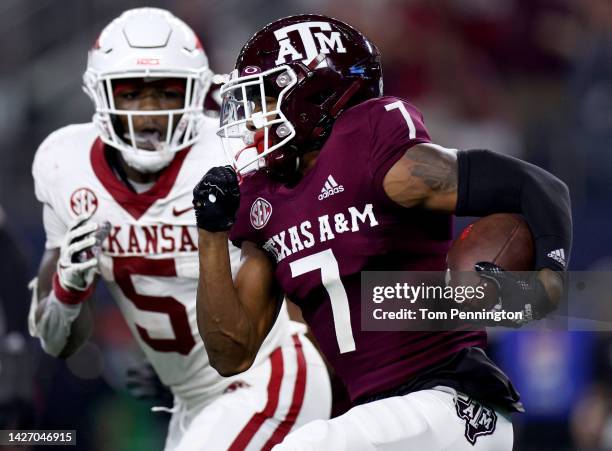 Defensive back Tyreek Chappell of the Texas A&M Aggies returns a fumble for a touchdown against running back Raheim Sanders of the Arkansas...