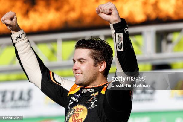 Noah Gragson, driver of the Bass Pro Shops/TrueTimber/BRCC Chevrolet, celebrates in victory lane after winning the NASCAR Xfinity Series Andy's...