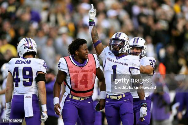 Que Reid of the James Madison Dukes celebrates after helping stop an Appalachian State Mountaineers 4th down in the fourth quarter at Kidd Brewer...