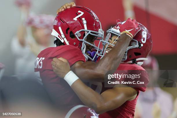 Ja'Corey Brooks of the Alabama Crimson Tide celebrates with teammate Bryce Young after scoring a touchdown against the Vanderbilt Commodores during...