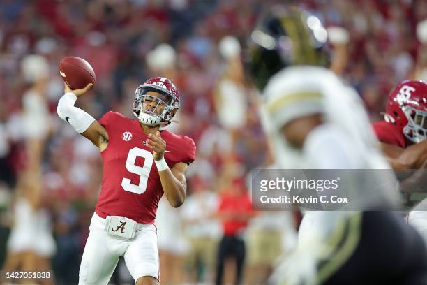 Bryce Young of the Alabama Crimson Tide throws a pass against the Vanderbilt Commodores during the first half of the game at Bryant-Denny Stadium on...
