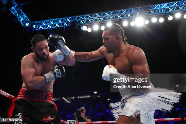 Joe Joyce punches Joseph Parker during the Vacant WBO Interim World Heavyweight Championship fight between Joe Joyce and Joseph Parker at AO Arena on...