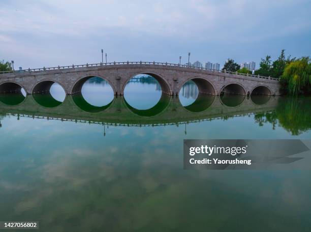 ancient arch stone bridge over the lake,suzhou,jiangsu province,china - arch bridge stock pictures, royalty-free photos & images